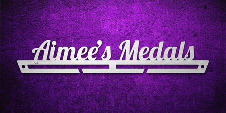 Custom images gallery medal rack with 'Aimee's Medals' in script font, personalized display for sports achievements.
