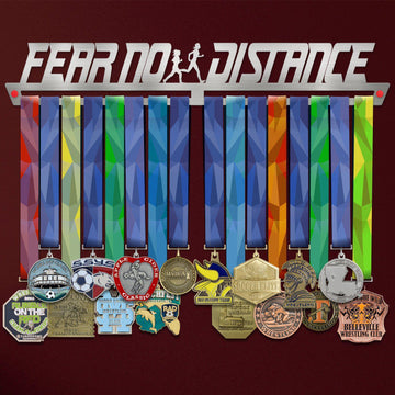 Fear No Distance Medal Hanger Display FEMALE holding colorful sports medals on a stainless steel rack with female runner silhouette design.