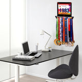 Race Bib Holder + Medal Hanger Display Rack V1 mounted in a modern office space, displaying colorful medals and a race bib.