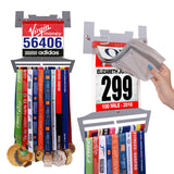 Race Bib Holder + Medal Hanger Display Rack V2 by Victory Hangers® showcasing medals and race bibs in a V-shaped grey metal frame with vinyl sleeves.